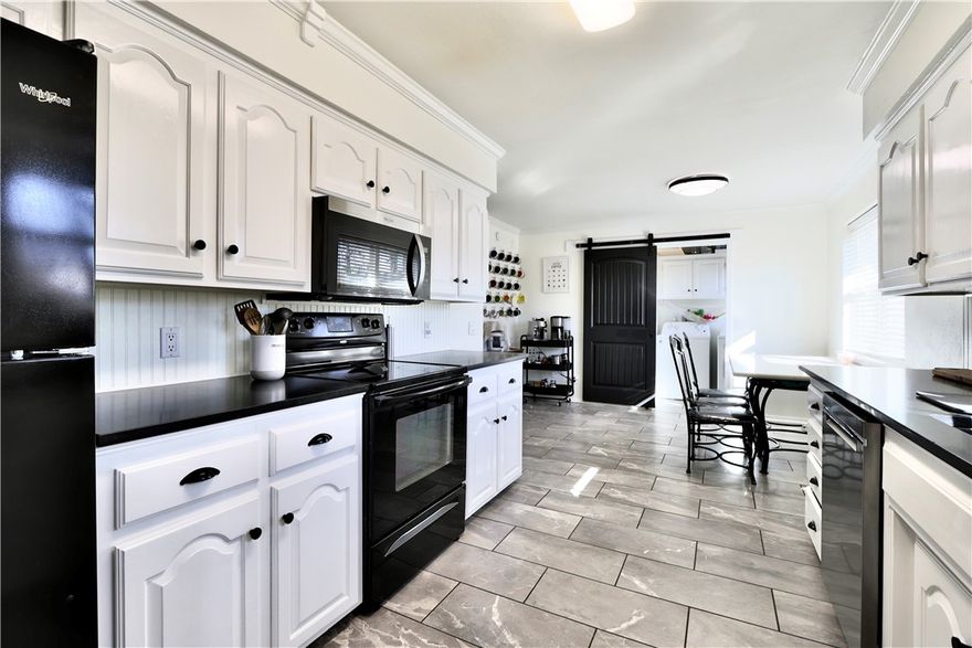 Discover this beautifully refreshed home in the heart of Rogers, offering the perfect blend of modern updates and everyday comfort. Recent improvements include updated flooring throughout, newer windows, giving you style, security, and peace of mind from day one.
Step inside to a bright, functional layout featuring a spacious living area and a fully updated kitchen with abundant natural light. 
Out back, enjoy a fully fenced yard ideal for pets, or simply unwinding in your own private outdoor garden space. Conveniently located just minutes from schools, shopping, dining, and local amenities, this home delivers comfort, convenience, and outstanding value. Move-in ready and waiting for you—schedule your showing today!