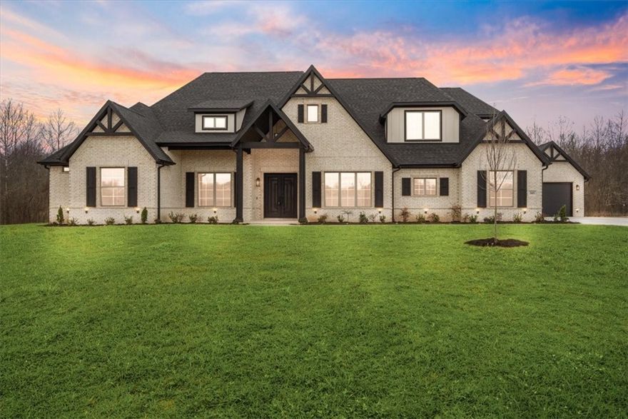 This remarkable new construction estate sits on a level 1.04 acre lot, offering abundant space and privacy. There is also plenty of room for a future in-ground pool. Natural light floods the open living and kitchen areas, creating an inviting atmosphere for gatherings or relaxation. The kitchen is a chef's dream, featuring a double oven, gas cooktop, pot filler, and an oversized pantry for organizational ease. The formal dining and study add elegance and functionality. The main level features 4 bedrooms / 3.5 baths, which includes a luxurious primary suite with a fireplace, double vanity, soaking tub, and a large walk-in shower. Upstairs you will find an additional bedroom/full bath, along with a media and bonus room. This home offers an ideal outdoor entertainment space with a grill, fireplace, and covered area with wooded views, providing a tranquil setting (there will never be a home built behind the property and will remain woods) Bentonville schools. Schedule a showing today!