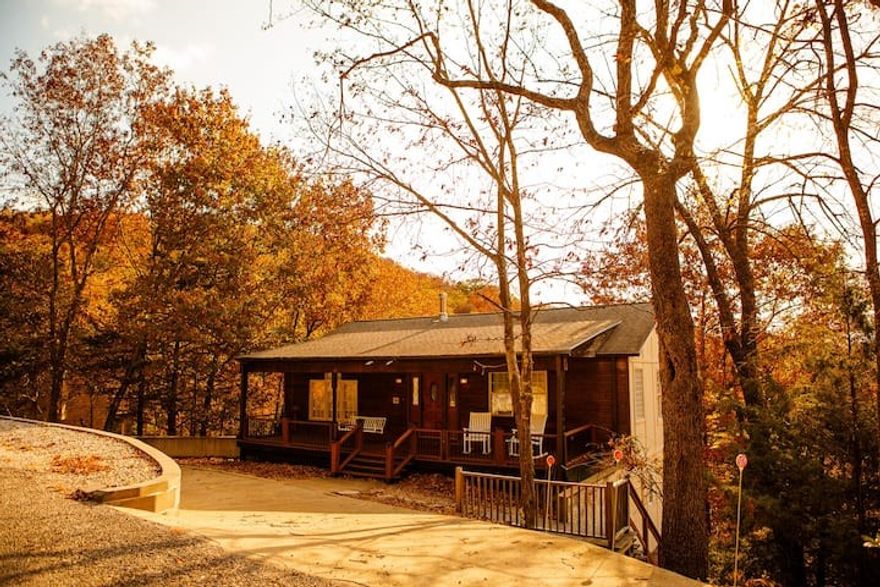 Discover your own slice of Ozark paradise in this beautifully updated, fully furnished Lake-Front Retreat. Perfect as a full-time residence, weekend getaway, or vacation rental, this property has undergone significant upgrades that blend rustic charm with modern comfort. Recent Improvements include Upper deck completely rebuilt with new wood and added structural support beams for long-term integrity, Lower-level deck rebuilt and fully screened-in creating an ideal bug-free outdoor living space, popcorn ceilings removed and the entire interior freshly painted, custom built-in bunk beds on the lower level—adds sleeping room for up to 5 guests, new washer & dryer installed in the lower-level utility room, all ceiling fans replaced throughout for improved efficiency and comfort. Spacious multi-level design ideal for entertaining and family gatherings, open-concept living with warm natural light and a tree-top view setting, two expansive decks overlooking the wooded surroundings. Access to Lost Bridge Village amenities.