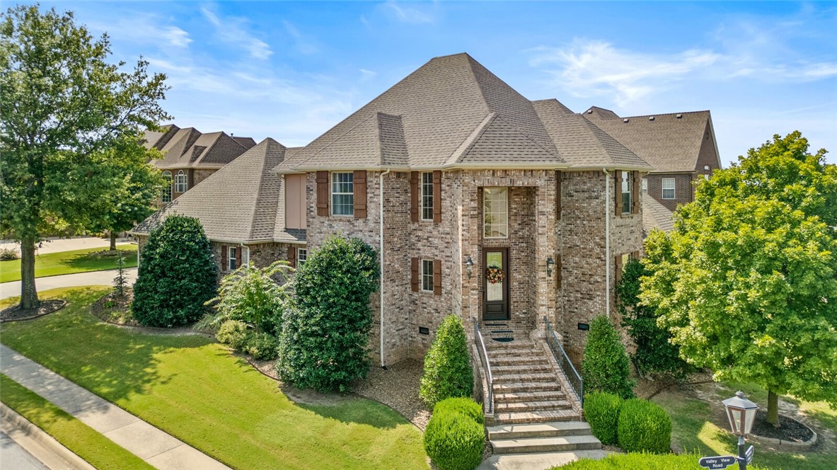 This stately residence is nestled on a prime corner lot in the gated Shadow Valley Country Club. The 3,627 square foot home features 4 bedrooms, 4 full bathrooms, spacious living areas, a formal dining room, gourmet kitchen, private study with built-ins, and a versatile bonus/recreation room. The luxurious main level primary suite offers a cozy gas log fireplace, private patio access, and a spacious spa-like bathroom. The home’s exceptional craftsmanship is evident with its beautiful hardwood flooring, the intricate millwork, and the fixtures and finishes. Outside, a spacious covered patio, framed by lush landscaping and a meticulously manicured lawn, provides an idyllic setting for relaxation and entertaining.