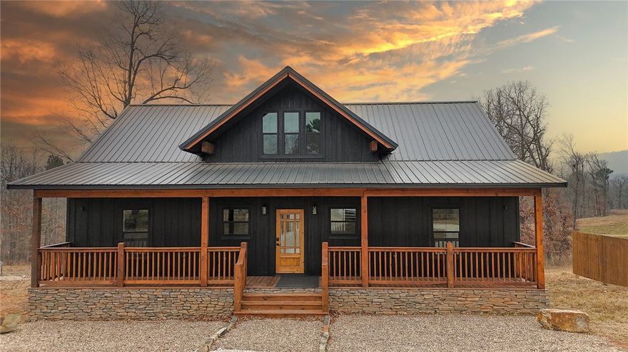 Discover an incredible luxury vacation and investment gem in Jasper, Arkansas—a charming mountain town rich with adventure and small-town charm in the heart of the Ozarks. This brand-new construction 3-bed, 2-bath home is located 4 miles from the Jasper town square. The exterior makes a striking first impression with black board-and-batten siding, stone accents, and warm stained wood details. Step inside to find a thoughtfully designed interior featuring cozy cottage-style finishes paired with modern amenities and an inviting open-concept layout. Unwind on the spacious decks while taking in mountain ridge views, or gather around the firepit with Adirondack chairs for relaxing evenings under the stars. Located near shopping, restaurants, hiking, biking, camping, floating the Buffalo National River, zip-lining, rock climbing, and more. Perfect as a full-time residence, vacation retreat, or high-performing Airbnb, this property delivers mountain living at its best—with the conveniences of a larger city close by.