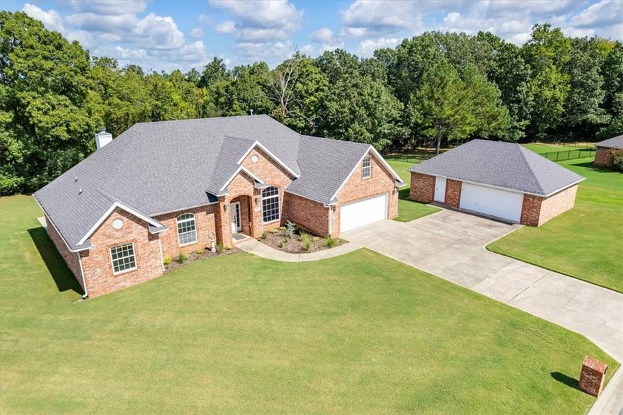 Enter your regal era in Forest Hills — one of Fayetteville’s most coveted subdivisions. This timeless, updated home sits on a rare 1.25-acre lot, the envy of the neighborhood. Inside, hardwood floors lead through stately rooms with soaring ceilings and custom built-ins, plus a versatile bonus room over the garage — perfect for a media lounge or game room. Outside, enjoy a detached garage with apartment, RV hookup, and elegant curb appeal wrapped in serene, majestic privacy.