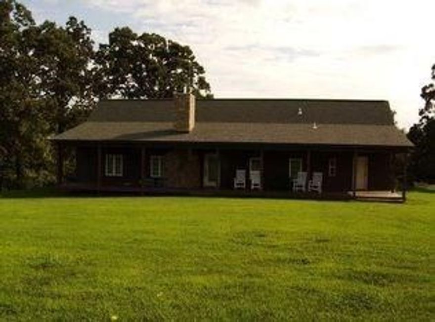 3 bedroom modular home on permanent foundation. Additional rooms constructed to original home. Large covered front porch, covered patio & 24,000 gal gunite in ground pool w/cool deck and metal security fencing. Open living, dining, kitchen w/wood burning stove. Secluded urban ranch w/horse barn, tack room, stalls, hay storage area & corral. Access from Wagon Wheel over low water bridge.