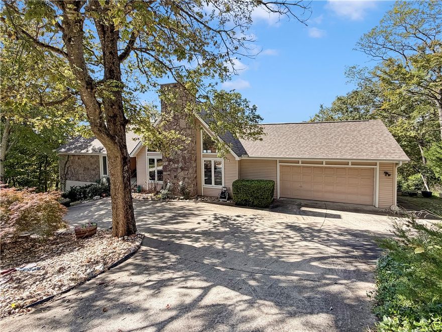 Custom 2,536 SF Home on corner lot with Stunning Views in Holiday Island!
Experience the beauty and serenity of the Holiday Island community in this one-of-a-kind 2BR 3BA custom home featuring breathtaking views of the historic Beaver Bridge from the spacious back deck. The home offers a versatile bonus room with a bathroom and kitchenette—ideal for a guest suite, hobby space, or potential third bedroom—with direct access to the lower deck. Inside, you'll find a custom wood-burning fireplace that adds warmth and charm, rich with a touch of Eureka Springs history. A truly unique property that combines comfort, craftsmanship, and captivating surroundings. Roof is less than 4 years old. HVAC 2 yrs old. Pool table to convey.