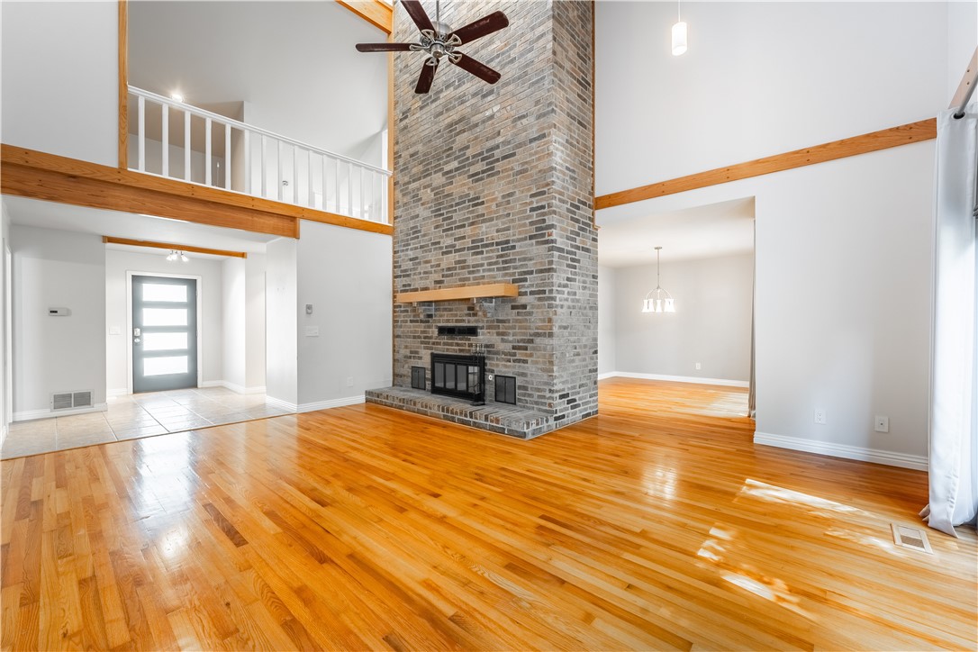 Natural light lovers and those who live to entertain guests will be obsessed with this beautiful 3-bedroom, 3-bathroom home in San Jose Estates. A big foyer leads into the living area. Enjoy high ceilings, floor-to-ceiling brick fireplace, wood floors, and an exit to the back patio. Formal dining room is next to living area and beside the kitchen. The kitchen has stylish black cabinetry and granite counters. Bonus seating area overlooking the living room at the top of the stairs. Primary bedroom has a massive closet, ensuite bath with soaking tub, double sinks, and walk-in shower. The best part of this room is through the double doors on the far wall - a private sunroom with patio access. The other bedrooms are large and carpeted. The big patio leads down to a walk-out basement and large fenced yard. This home is right in between Springdale and Fayetteville, giving you easy access to all the best parts of NWA. Home warranty to convey to buyer!