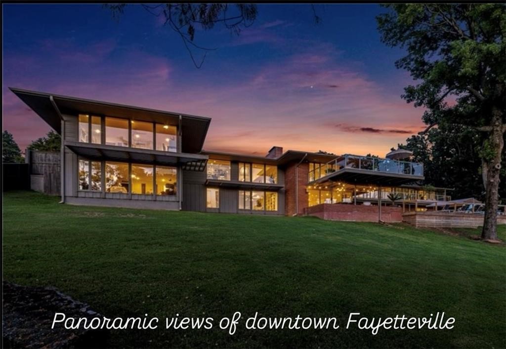 SOLD UPON PRINT. Gorgeous completely renovated mid-century modern marvel with panoramic views of downtown
Fayetteville and Old Main. Designed by Edward Durell Stone, this 6-bed, 6-bath, 8,495 sq ft estate offers rich history! Eddie Sutton built the basketball court. Situated on 1.05 acres in prestigious Mt. Sequoyah, the property features a complete renovation of the original and new architecture. The main level boasts two master suites and two more bedrooms (all with views), a gourmet kitchen, and office space. The lower level is perfect for multi-generational living or just as is for large families to enjoy, with two more bedrooms, a home gym, safe room, game room, laundry, and a second living area that opens to the pool. This open, modern home offers stunning design and expansive views. Enjoy seamless indoor/outdoor living with a cantilevered deck and resort-style pool on two parcels. Don’t miss the video walkthrough! Some Furniture Negotiable.