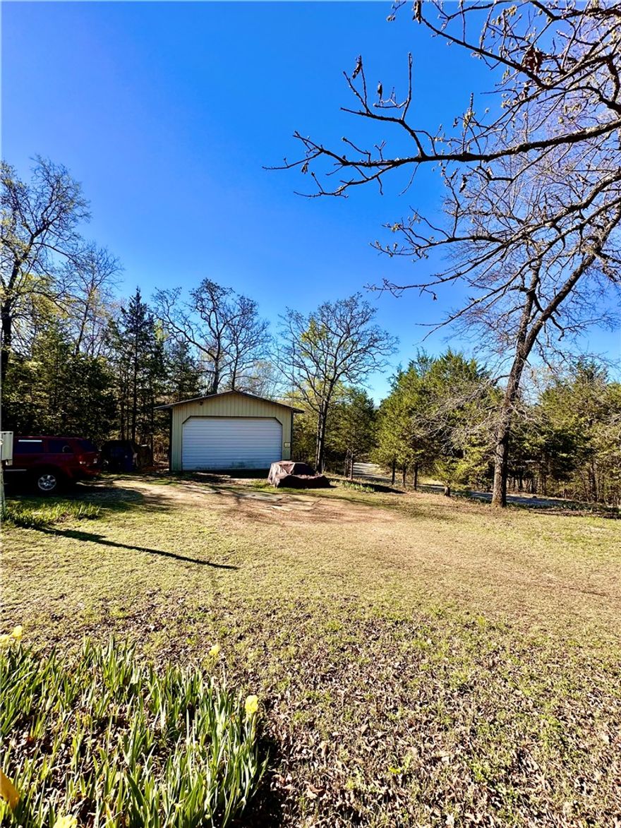 Looking for the perfect blend of privacy, versatility, and proximity to the water? This 1.5-acre property offers a unique opportunity just minutes from Bull Shoals Lake! The standout feature is the shop building with custom door and windows on three sides, designed to bring in natural light and create a warm, inviting feel—far from your typical shop. Whether you envision a fishing camp, weekend retreat, or private getaway, this space is ready to fit your lifestyle.Enjoy the peaceful setting within walking distance to Bull Shoals Lake, giving you easy access to fishing, boating, and outdoor adventure. Conveniently located just outside Lead Hill, you’re only 25 minutes to Harrison and less than an hour to Branson, MO—perfect for both relaxation and entertainment.This is your chance to create the getaway you’ve been dreaming about!
