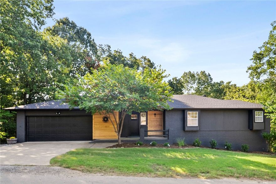***Seller now offering $5,000 buyer concession!*** Freshly remodeled and move-in ready, this 3-bedroom, 3-bathroom Bella Vista home blends modern style with everyday functionality. Inside, the kitchen stands out with custom cabinetry and sleek quartz countertops, opening to bright living spaces with hardwood floors upstairs and LVP flooring downstairs. The primary suite is a true retreat, featuring a large walk-in closet and a beautifully updated tile shower. Throughout the home, you’ll also find ample storage for easy organization. Enjoy multiple living areas including a sunroom filled with natural light and a lower-level bonus space with a wet bar, perfect for entertaining, game nights, or a private retreat. Step outside to relax on the covered patio or in the fenced backyard, ideal for pets, gatherings, or quiet evenings outdoors. With its fresh exterior, stylish finishes, and versatile floor plan, this home captures the best of Bella Vista living.