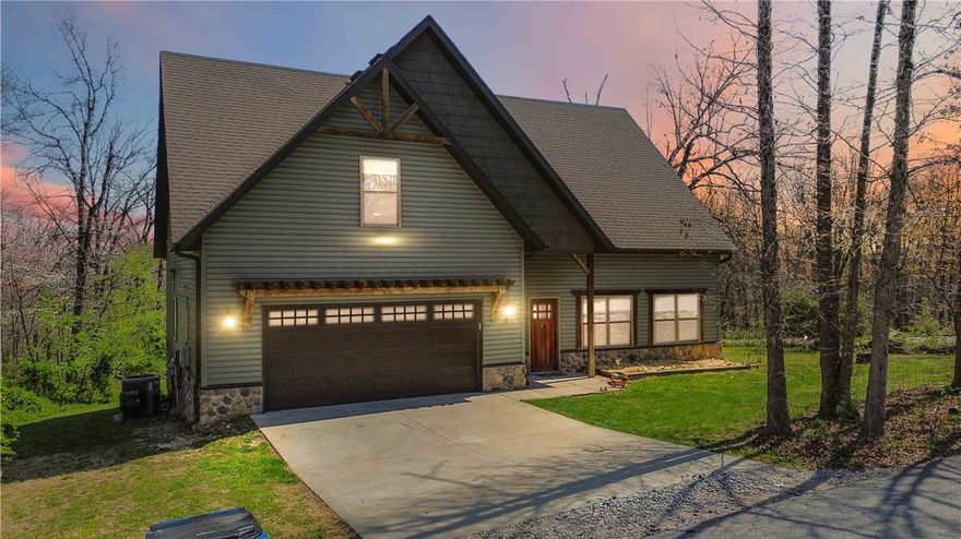 Built in 2019, this well-maintained home offers a functional, open layout with abundant natural light, a spacious living area with fireplace, and a kitchen featuring ample cabinetry and recent updates including repainted cabinets and new elements. The primary bath includes a new dual sink, and thoughtful improvements throughout add to the home’s comfort and appeal.



Enjoy the peaceful, wooded setting from the back porch, where native birds and deer are frequent visitors. The property also features an invisible dog fence and expanded landscaping with garden beds. Located just minutes from Tweety Bird Trail, Huntley Gravity Park, the Back 40 Loop, and Lake Windsor, with access to Bella Vista’s amenities including golf, trails, and more.