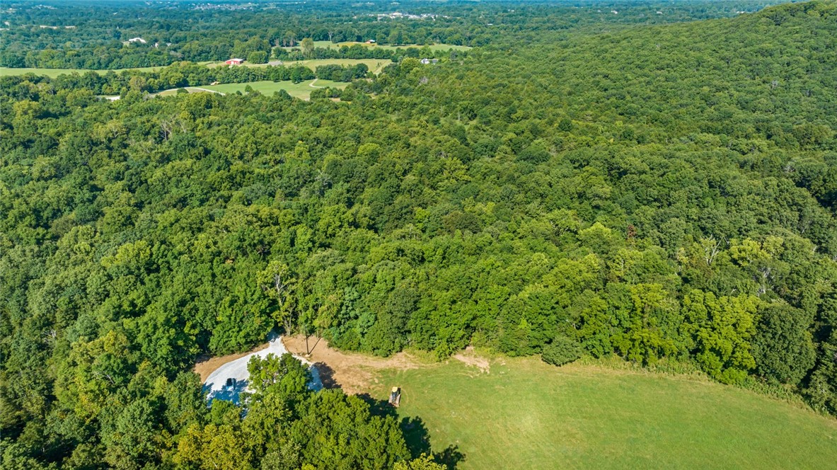 Located in Goshen Arkansas and in the Fayetteville School District you will find a rare opportunity to build your custom home on a private five acre lot located in the prestigious Cedar Ranch Estates. Designed to preserve the natural beauty and privacy appreciated in the Goshen area, and with opportunity to design the perfect dream estate. Each lot is uniquely different ranging from beautiful valley views, to stream side oasis, to pond side elegance, to rolling grassy fields. With each lot you will have the opportunity to create a home on an estate sized lot with the unique features desired by everyone. Come visit Cedar Ranch Estates and make it your last home.