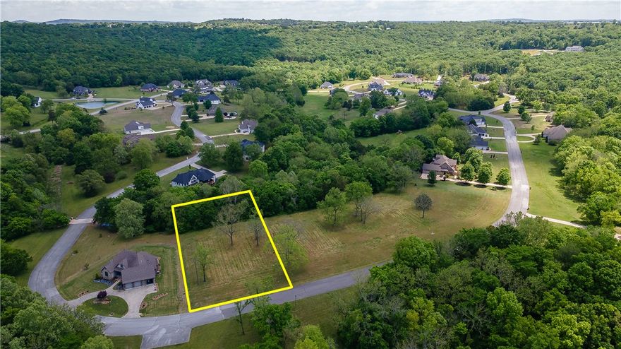 Build your dream home in one of East Fayetteville’s most desirable neighborhoods—The Knolls! This spacious 1.00-acre lot offers a unique topography that opens up creative possibilities for a custom design. Utilities, including electric, water, and gas, are available at the street. Nestled in a scenic and established community, you'll enjoy access to outstanding amenities: a neighborhood pool, tennis court, pickleball courts, pool house, and walking trails. A rare opportunity to create something special in a location that truly has it all.