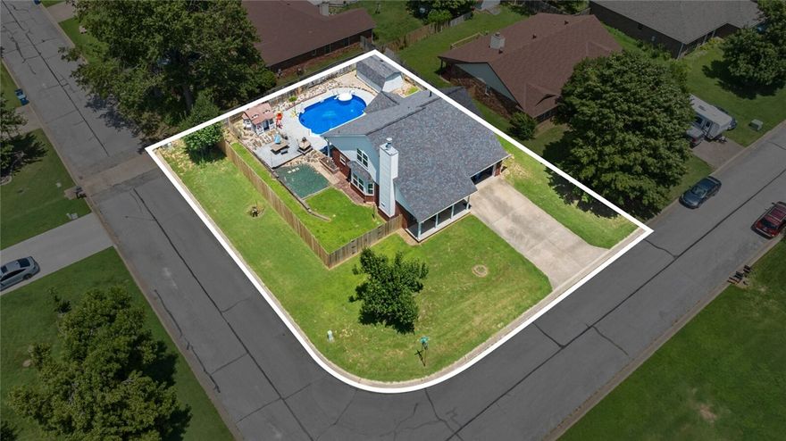 Location, location, location! This spacious 4BR/3BA ranch-style gem sits on a prime corner lot in sought-after Pleasant View Estates in SE Bentonville. With approx. 1,880?SF on a level 0.23-acre lot, this home offers a perfect blend of comfort and convenience. The spacious, open living area features a cozy gas fireplace, and the eat-in kitchen boasts generous cabinet space. The main level includes a primary suite, a guest bedroom, and a guest bathroom for added flexibility, plus an attached 2-car garage. Step outside and prepare to be impressed—your own backyard oasis awaits! Enjoy the 10,000 gallon in-ground pool, patio, playhouse, and storage shed—all within a fully fenced yard perfect for entertaining, relaxing, or family fun. Just minutes from downtown Bentonville, Crystal Bridges, world-class biking trails, top schools, I-49, and Walmart HQ, this home puts you in the heart of it all. Don’t miss this incredible opportunity to own in one of NWA’s most desirable locations!