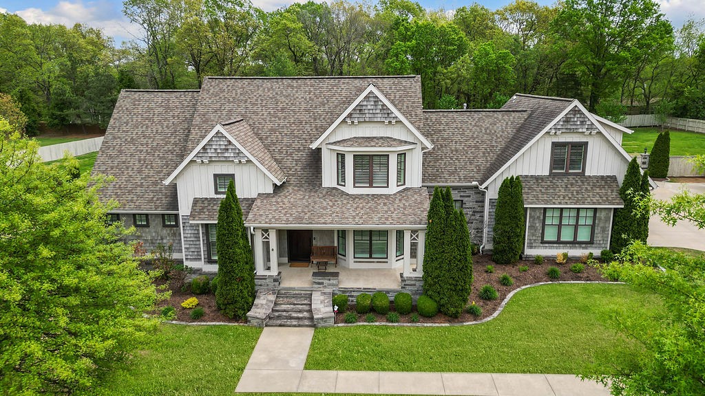 This immaculate custom home in the desirable Bridlewood Estates, is nestled on 2 private & beautifully landscaped acres. Main level features two separate primary suites, each w/ full bathrooms, large walk in closets, built in storage. Dedicated office & separate formal dining room, 1/2 bath. Kitchen has Thermador appliances, quartz counters, custom cabinetry, separate pebble ice machine, reverse osmosis water filter, Eat in kitchen looks out to lovely landscaped backyard. Vaulted ceiling in living room w/ built-ins, electric fireplace. Sliding doors go out to enclosed All season patio w/ gas fireplace. Hardwood floors & plantation shutters throughout the home. Safe room,4-bay garage w/polished concrete floors. Upstairs has 2 spacious guest rooms, full bath, large bonus room. Outside detached 3-bay garage w/ moveable car lift & upstairs loft area. 3 Trane HVAC units . Peaceful upscale living just minutes from city amenities and walking distance to Sassafras Winery. Please see attachments for upgrades and more info.