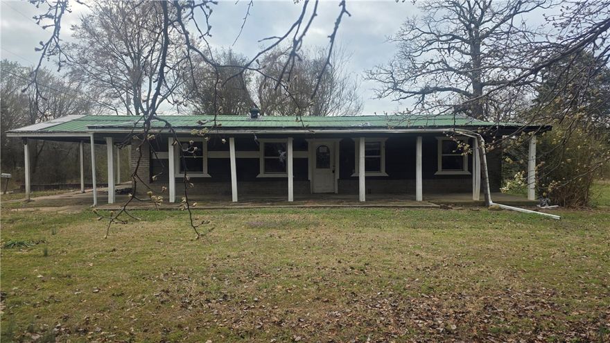 This 4-bedroom, 2-bathroom house sits on a generous 0.83-acre lot and comes with the added bonus of a large workshop, ideal for hobbyists, craftsmen, or storage. The home itself is in need of repairs but has great potential for a fixer-upper project. Despite the need for repairs, the large lot provides significant potential for outdoor improvements, gardening, or even expansion projects. With the right renovations, this home could be restored to its full potential, making it an attractive investment or a personal renovation project.