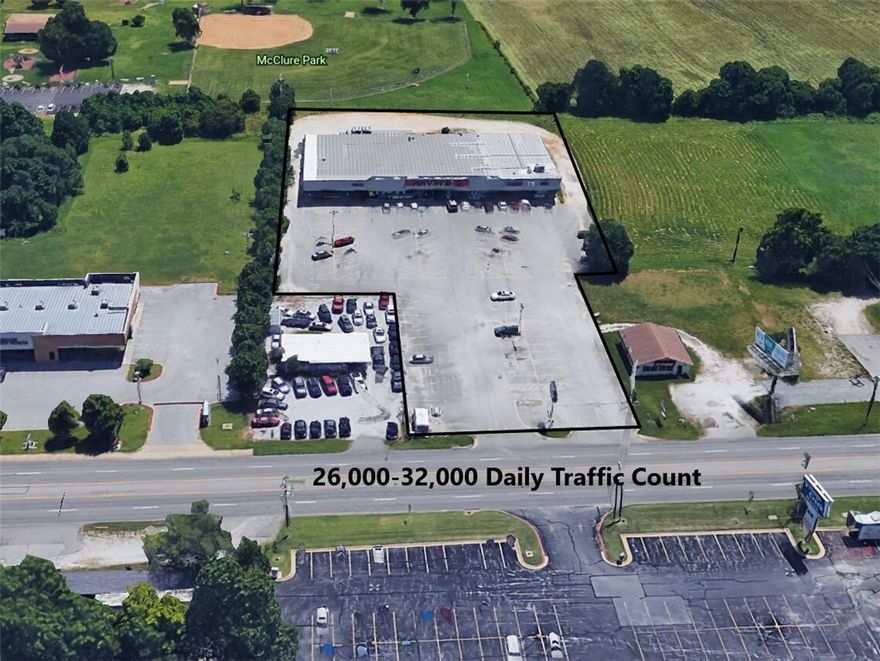 Less than 1 mile from I-49. Brand new roof! Prime commercial location with 26,000 to 32,000 daily traffic count near busy intersection! 128' of road frontage. 98 well lit parking spaces, lighted roadside sign, 20,610 square feet of space on 2.47 acres with endless conversion possibilities.