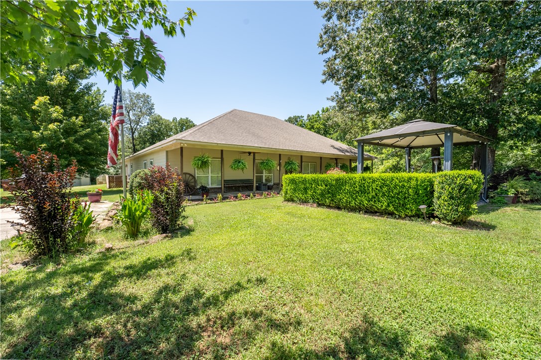 Welcome To Your Next Home! Room To Roam With This Home On 4 Acres With A Park Like Country Setting, Yet Easy Access Back To Town. Take It All In While Sitting Sipping Lemonade On The Huge Covered Front Porch Or Back Patio Area. Coy Pond And Small Pond On Site. Split Floorplan 4 Bedroom Home + Office. Spacious Living Room With Vaulted Ceiling. The Inviting Kitchen Offers Plentiful Counter And Cabinet Space. Built-in Speakers Throughout Home. And For All Those Cars, Boat, And Other Toys...Get This...This Home Offers A 2 Car Attached Garage PLUS A 4 Car Detached Garage PLUS A Detached Storage Building. Come See, Put Your Vision To Work And Make This One Yours!