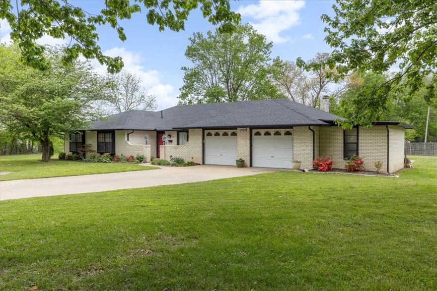 Located just off Don Tyson, this fabulous home has been updated through time, keeping the character of the 1970's. In the kitchen, you'll find a unique curved banquette with table & chairs, Corian countertops & spacious pantry. Versatile office or craft area just off the living room provides plenty of light from the wall of windows. The family room features a built-in bookshelf & a cozy gas starter brick fireplace, with access from the back to bring in firewood for those chilly nights. Additional features include a sprawling lot with a drive-through backyard gate, off of the oversized garage is a workshop with built-ins for all your projects. This home has an expansive layout providing plenty of indoor and outdoor space, wide doorways, ramps & other ADA compliant modifications such as zero-step shower entry. A new roof in October 2025, newer wood flooring throughout the main living areas in 2014, washer, dryer, 2 fridges negotiable. Located minutes away from Tyson Corporate Office, I-49, AR Childrens Hosp & more.