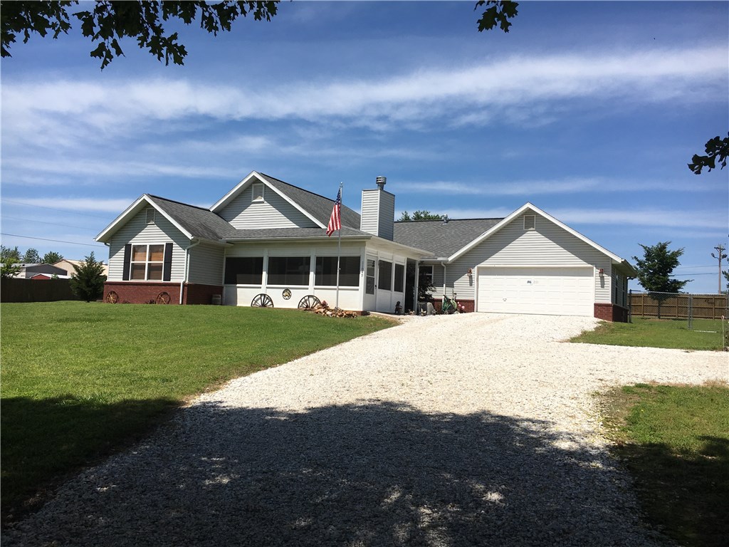Well maintained home on approximately 1.4 acres with many upgrades including wood privacy fence, white fence, insulated garage door, screened in front patio, covered back patio, hot tub, storm doors, granite counter tops in kitchen, door from garage to backyard, large laundry room with sink, two out buildings, storm shelter and 13 additional trees planted. Water heater, garbage disposal, microwave and kitchen sink have all been installed two to three years ago.