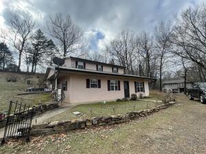 Neat and tidy house that is close to town and nearly two acres. 3 or 4 bedroom, 2 bath 1,660 square foot home. Upstairs could be turned into apartment with own entrance.