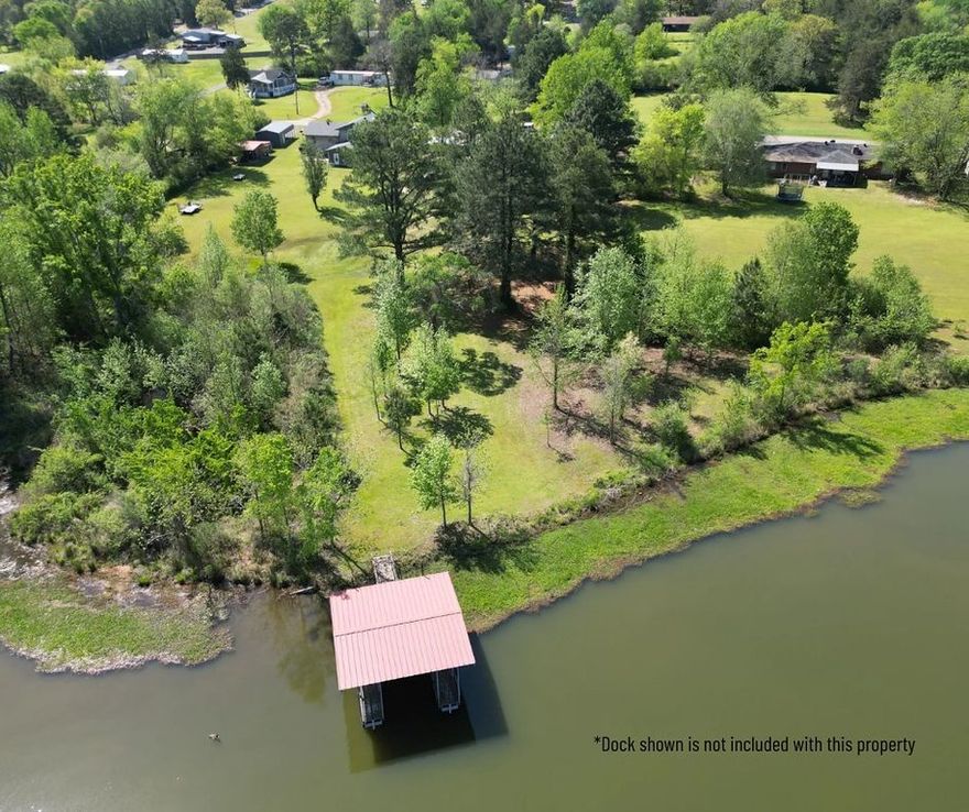 Enjoy lake living with the convenience of being close to town in this newly remodeled 3-bedroom, 2-bath home featuring beautiful lake views and backyard access to the water. Inside, you'll find a spacious primary suite with a large walk-in closet, a cozy fireplace in the living room, and a sunroom just off the kitchen and living area—perfect for relaxing or entertaining. The home also includes a newer roof, a good-sized laundry room, and an in-ground pool that offers great potential with a little maintenance. Step out onto the brand-new back porch to take in the peaceful lake view and spacious backyard. A large driveway and 2-car carport provide plenty of parking. Don’t miss this move-in-ready retreat just minutes from town!