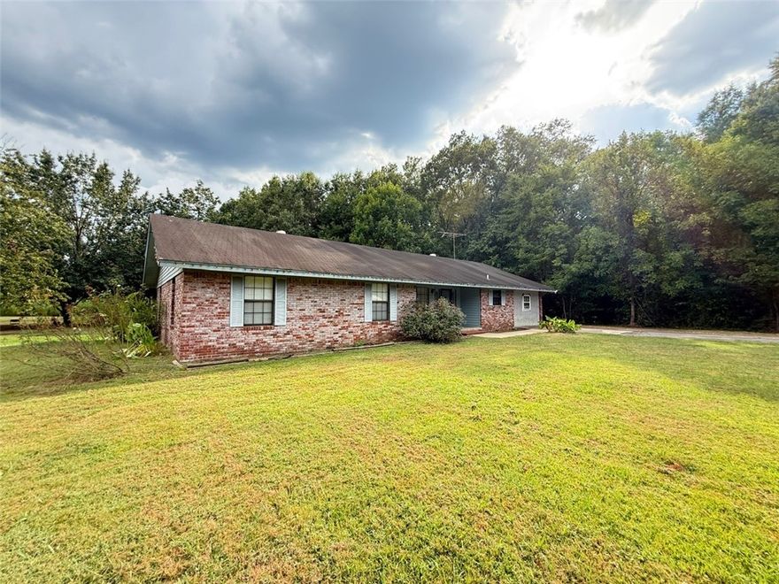 Beautiful home nestled on 3.46 acres, offering the perfect blend of comfort and country charm. This spacious 3-bedroom, 1-bath home features a versatile bonus room ideal for a game room, gym, or home office. Enjoy large open living and dining areas, a generous kitchen with abundant cabinet space, a breakfast bar, and a roomy laundry area. Additional features include ceiling fans, an attic fan, and a recently updated central AC and heat system (only 3 years old) for year-round comfort.

Outside, you'll find a large detached workshop with a concrete floor and half bath — perfect for family gatherings, hobbies, or extra storage. The property also includes an outdoor wood-burning system that provides heat and hot water for the home. With plenty of space for gardening, animals, or outdoor activities, this is an ideal spot for your mini-farm dreams. Don’t miss the opportunity to make this peaceful retreat your own — schedule your showing today!