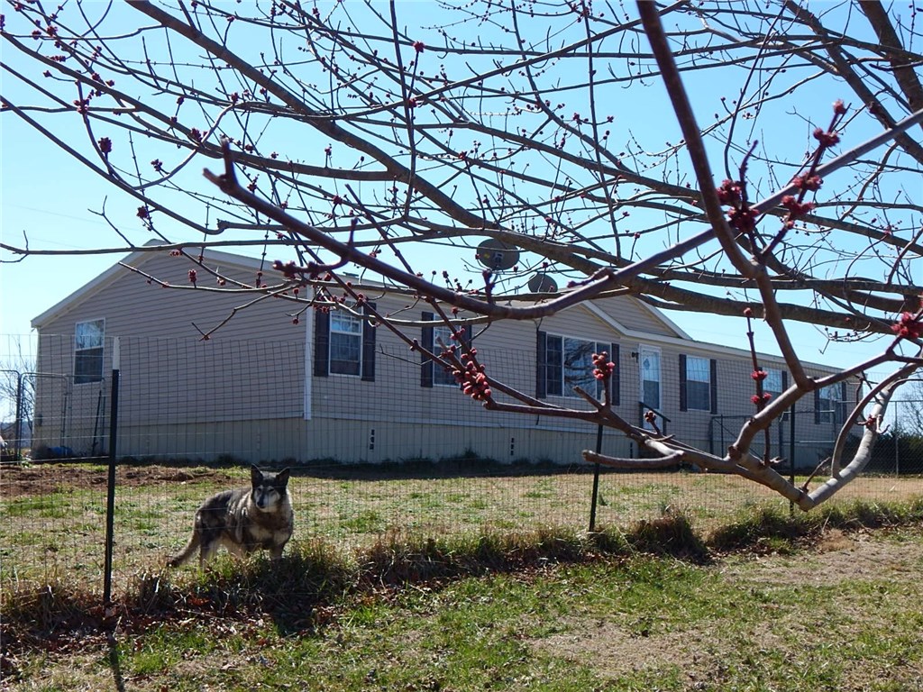 Enjoy the fabulous view of the Ozark Mountains from every corner of this 5 acres on top of the mountain! Spacious 4 BR mobile home w/ oversized kitchen & dining area w/ built-in hutch. Relax by the FP in the family room or enjoy the back deck.New HVAC 2014. New road & DW 2015. New water pump 2016. Master suite w/ vaulted ceiling & private bath shower & sep. garden tub. FHA financing available. Mailing address is Winslow. Greenland or West Fork Schools. Come home to the country - you'll love it!