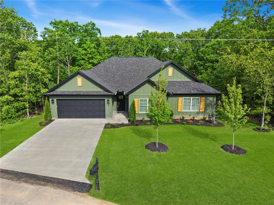 Beautifully crafted 1,950 sq ft home in the heart of Bella Vista! This 2 bed, 2 full bath home plus dedicated office offers a perfect blend of comfort and functionality. Enjoy an open, light-filled layout with spacious living areas, a cozy fireplace, and a stunning kitchen featuring ample cabinetry and a large island—ideal for entertaining. The primary suite provides a relaxing retreat, while the additional bedroom and office offer flexibility for guests or remote work.

Step outside to a covered back deck overlooking a peaceful, level yard—perfect for outdoor living. Storage is abundant throughout the home, making organization effortless.

Located within short walking distance to Branchwood Recreation Center, enjoy access to pools, fitness center, pickleball courts, and scenic paved trails. Plus, you’re just minutes from Loch Lomond for boating, fishing, and lakeside relaxation. A perfect combination of lifestyle, location, and livability!
