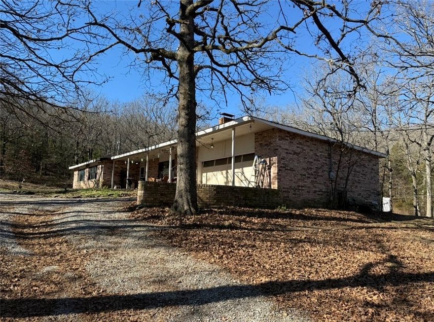 Scenic views and fully mature trees on this property. Jut minutes from downtown Fayetteville and the University of Arkansas.  The home is being sold "as is". Dirt road was repaired and filled in with more dirt this past summer. 21.86 acres and home available MLS#1332903.  6 acres available MLS#1323720.