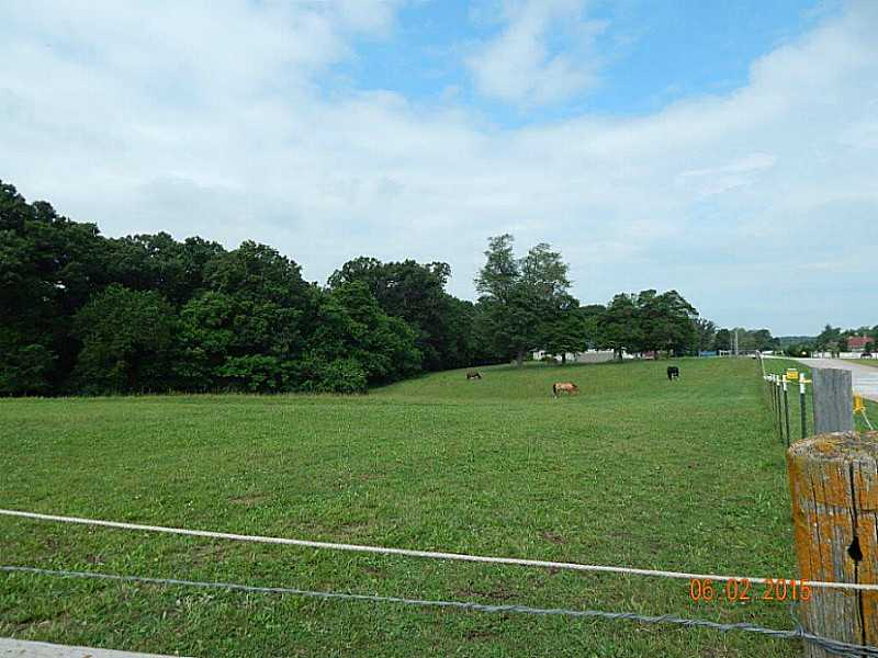 ROLLING 9.72 ACRES PARTIALLY FENCED. CAN BE USED FOR HORSES, COWS, HIKING OR 4 WHEELING. FRONT OF PROPERTY IS OPEN GRASSLAND. THERE IS A METAL BUILDING FOR ANIMAL SHELTER. THE BACK OF PROPERTY IS WOODED WITH TRAILS FOR RIDING, 4 WHEELING OR WALKING.,Will do owner financing on above referenced property @ current rate with 5K down.