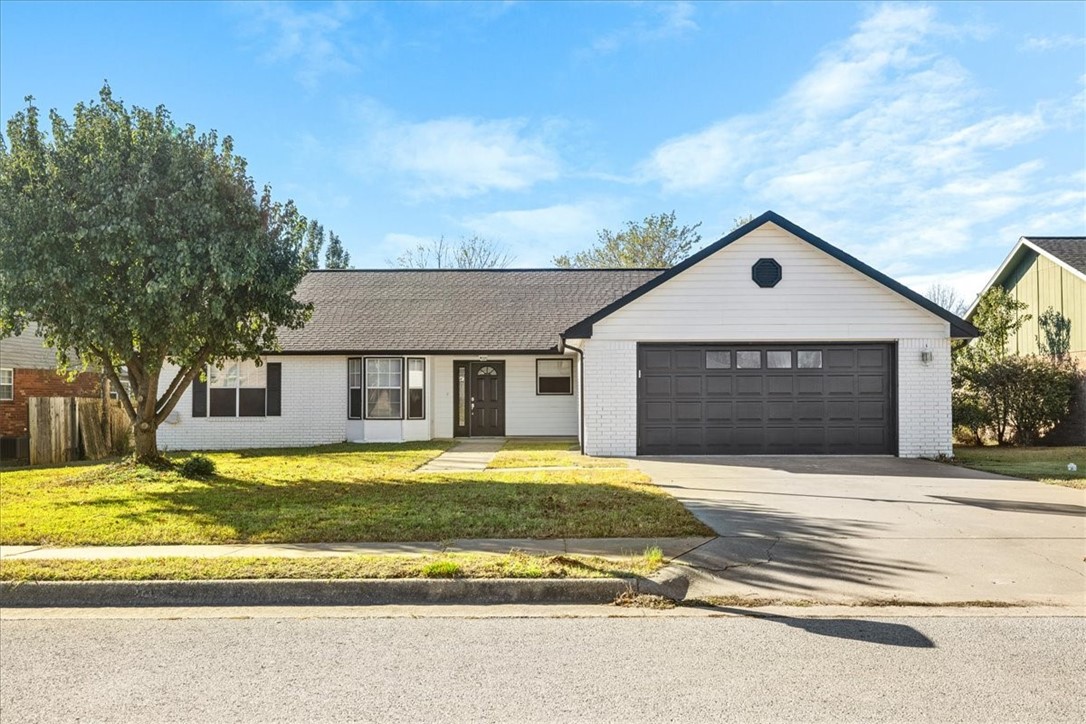Affordable single-family home in East Rogers with the Greenway Trail system right in your backyard! This 3-bedroom, 2-bathroom home features a split floor plan and LVP flooring in the living area with a cozy fireplace. The eat-in kitchen offers plenty of storage, and the spacious bedrooms provide ample comfort. Step outside to a partially covered deck that overlooks a large, fenced yard, complete with a gate leading directly to the Tuttle Creek bike trail.