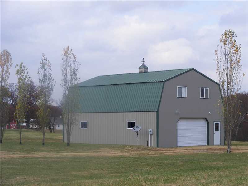 BARN STYLE HOME ON 5 ACRES WITH 1 BEDROOM, 1 BATH, LARGE LIVING ROOM ALL UP STAIRS WITH A 2 CAR GARAGE DOWNSTAIRS.