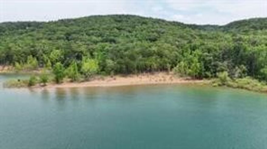 Unique opportunity to build your dream home on this beautiful 1 acres +/- lot bordering corp land on Greers Ferry Lake. Gated secured and paved entry, end of the road location, corp land on two sides, lake views, corp approved walking trail to the shoreline and large beach for swimming and fishing with Eden Isle, Miller's Point and Shilo Marina in view. Includes a 1800 sft concrete slab with power and water stub outs, floor drains,  foundation french drain, 14' high poured and concrete blocks walls,  Water, electric, and 40 amp RV power in place. Lot has been perc tested. In city limits and only 7 miles from downtown. Call for your showing today!