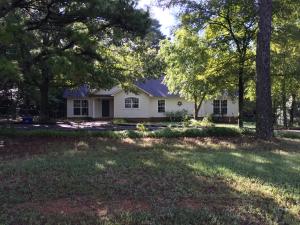 Beautiful home with nearly a couple acres that is close to town. Enjoy your mornings and afternoons in your screened in patio. This home has new flooring through out and new paint,new appliances, a utility room, and the back yard is fenced. Roof is being replaced. 3 bedroom / 2 bath, $139,900.00