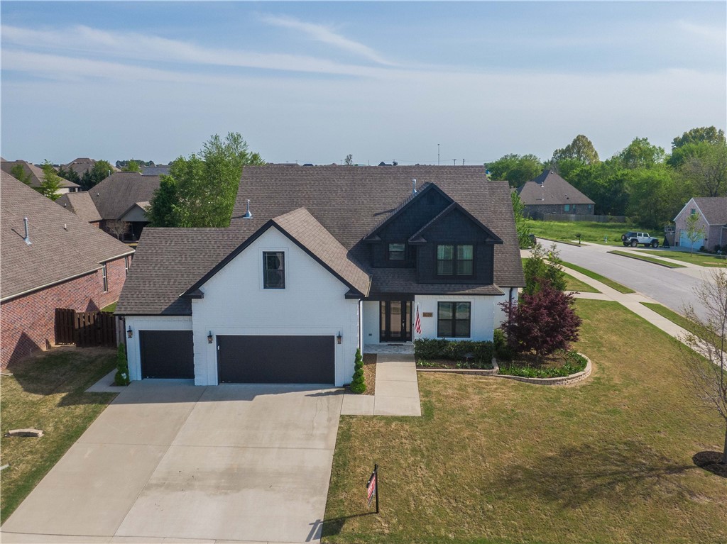 This is it! Immaculate home with ALL the bells and whistles. Gorgeous white painted brick with black accents and fully landscaped located in Tuscany Subdivision. This home offers 4 bedrooms, office, movie theater, double ovens, wood burning fireplace, wood floors and additional utility garage/workshop. Loaded with upgrades to include wine fridge, ice maker, media room equipment, smart shower, and tons of remodeled spaces. Within walking distance to three schools. Please note all movie theater equipment, appliances, and theater furnishings convey with the home. Don't miss out on this home! It's a special turn key opportunity to live in the heart of NWA, just minutes from I-49.