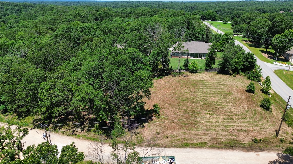You cannot miss this property 2 lots totaling .66 acres on the corner of Bethnal Rd and Pagham Ln. The corner lot has been cleared and is ready to build. Lot is relatively flat a hidden gem in Bella Vista. Cozy neighborhood with new construction homes awaiting its future owners. Close to back 40 trail access and Metfield Clubhouse. Perc test available and survey.