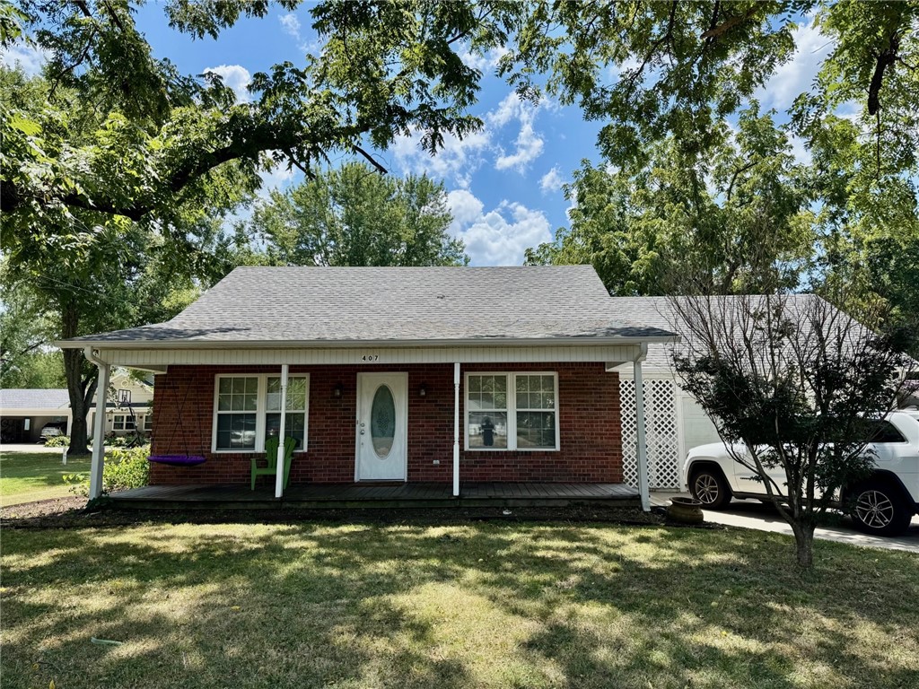 A great location in downtown Prairie Grove. Walk to the store, parks, and even a couple of restaurants. Brick home features 3 generous bedrooms, 2 full bathrooms, and an oversized 1-car garage with workshop and storage areas. Updates include flooring, paint, some fixtures, windows, and stainless appliances. Large pantry/utility room. Roof is approximately 5 years old.