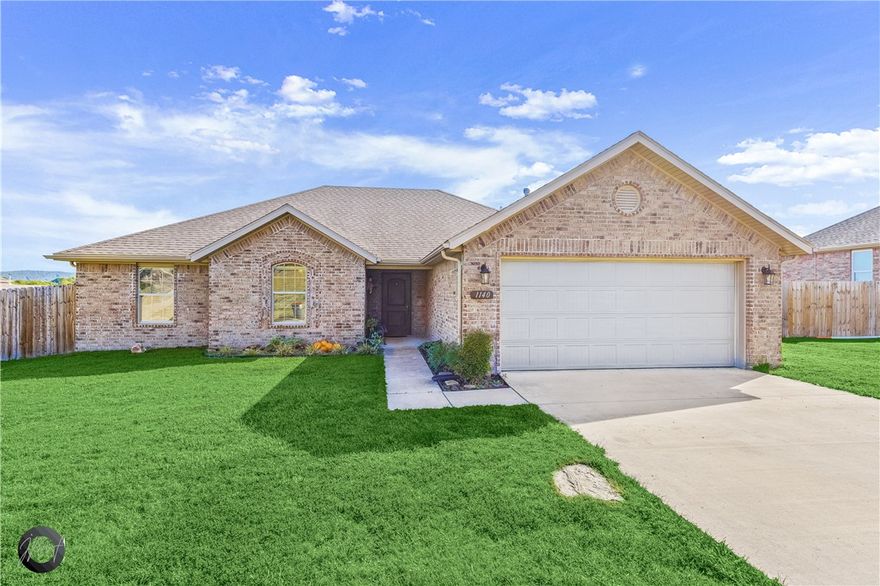 Beautiful brick home in a great area! Spacious living room with tall vaulted ceiling & wood beam, wood flooring, gas log fireplace, and open to the kitchen. Kitchen has granite counters, plenty of cabinet space, electric cooktop, bar seating space and eat-in area. Master has tray ceiling, crown molding, dual vanity, separate walk-in shower and jetted tub, and large walk-in closet. Garage has been converted into bedroom but can easily be converted back. Sit out and enjoy the back covered stone patio or grill out. Spacious privacy-fenced backyard including a fenced off area for dogs to play. Large workshop to store your tools and work on projects. Comes see this one now!