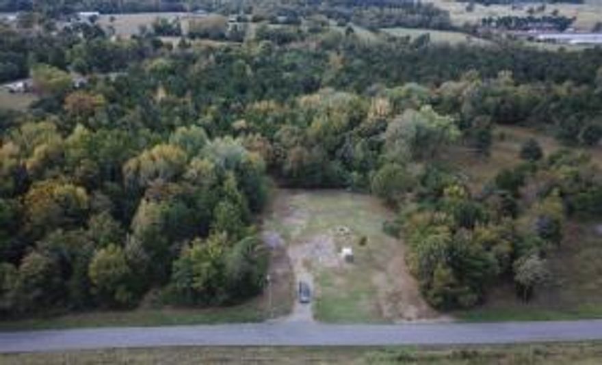 Experience the ideal fusion of countryside tranquility and nearby city accessibility!This generous 4- acre parcel provides a peaceful rural setting while remaining conveniently close to town amenities. With electric, water, and septic already set up, you can dive right into your vision. Plus the absence of restrictions allows you the liberty to design your perfect retreat. Seize this incredible opportunity today!