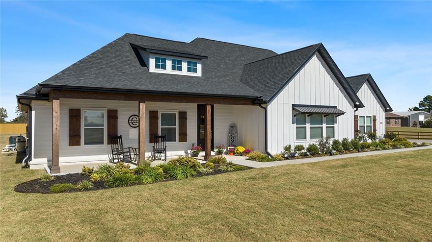 This stunning home is loaded with amenities! Built in 2023 with additions over the last year. The home sits on 1.39 acres. The interior is clean and sleek. The kitchen is overflowing with storage in the ceiling height cabinets and walk in pantry. The primary bed and bathroom are a sanctuary with its massive walk-in closet, free-standing soaking tub, and glass-wrapped walk-in shower. The second living room/sunroom has its own fireplace. As you walk out the back door you are greeted by a LARGE 16x32 heated salt water pool with a shallow lounge area at one end. You won't get sunburnt under the permanent awning. If you run out of room in the attached 3 car garage there is an additional detached 24x24 garage shop with door opener and insulated walls. Bring your friends and family to see this beautiful home!