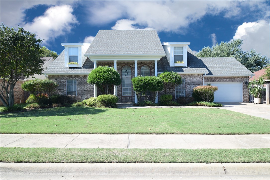 Fabulous Fairy Tale home with unique spiral staircase and stained glass windows. Turn key ready 3100 SF home featuring newly painted & remodeled interior, 3 bed/3 bath, office, formal dining room, red oak flooring, gas fireplace, SS appliances, porcelain tile flooring in kitchen. Unique apt living/in-laws quarters upstairs with it's own bonus room and bath. Approx $30,000 of hardwood flooring. Full ADT Security system upstairs & downstairs. Heated garage - gas wall heater & new double insulated garage door. Natural gas hookup for grill. Full sprinkler system - front & back. Can easily be converted to a 4 bedroom house. Close to Sam's Club HQ, Walmart ISD & HQ and close to future new Walmart HQ!