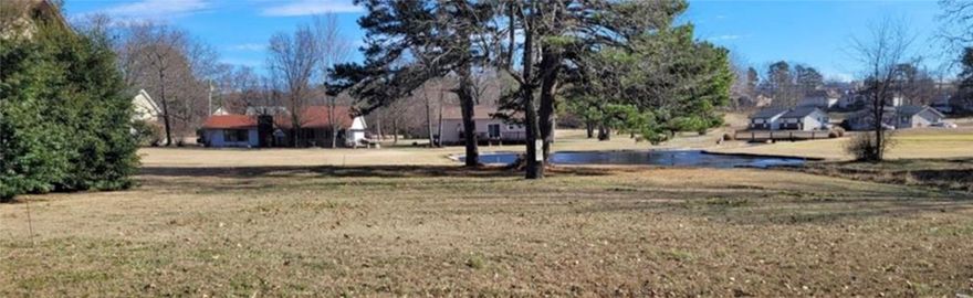 Nestled on a scenic lot along the 18 hole golf course in beautiful Holiday Island, this property offers stunning views and serene surroundings - complete with a tranquil pond just beyond your backyard.  Imagine sipping your morning coffee while watching the sunrise over the water, or enjoying sunset strolls with fairway views right outside your door.  Located in a quiet, well-maintained community with access to amenities like golf, tennis, pickle ball, boating, and hiking, this is the perfect spot for a permanent home or a peaceful getaway.  And with historic Eureka Springs just 5 miles down the road, you'll have easy access to charming shops, art galleries, restaurants, and entertainment - all while enjoying the natural beauty and calm of Holiday Island.  Don't miss this rare opportunity to own a prime golf course lot with water views in one of Northwest Arkansas's most scenic communities!