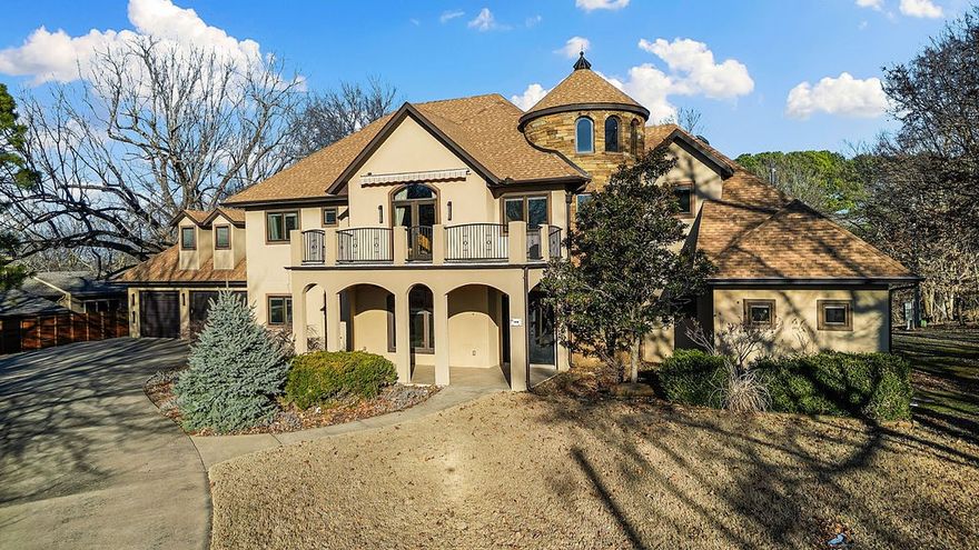 Discover 608 N Sequoyah Dr, a stunning Mediterranean-style custom home in Fayetteville, AR, brimming with luxury. Step onto elegant marble floors that guide you to a flexible dining/art room and a grand living area with vaulted ceilings and a cozy seasonal fireplace. The semi-professional kitchen boasts a Miele coffee center, speed oven, Sub-Zero Pro G 48 fridge, Blue Star commercial stove, jatoba wood-finished storage, and a walk-in pantry. Adjacent lies a family room and breakfast nook opening to a large patio with a ceiling fan and gas grill hookup. The main level offers a king-sized bedroom with a walk-in closet and a lavish bathroom featuring Grohe fixtures, Villeroy & Boch sinks, a Jacuzzi tub, and a walk-in shower. Upstairs, find four bedrooms with walk-in closets, three bathrooms with radiant floor heating, and a central bedroom with a hot steam bath. Highlights include Anderson Eagle low-E windows, soy-based insulation, and a new 2024 roof.