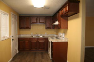 Cute remodeled home under $75,000. 3 bedroom 1 bath home with fenced in back yard. New floor coverings, new paint, new kitchen cabinets and new bathroom. Also offers a one car carport.