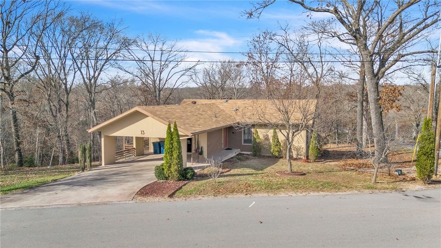 Hard to find 3-bedroom, 2-bathroom home in Bella Vista with two additional lots (approx. .88 acre) for incredible privacy - backing up to POA land in a quiet neighborhood of lake area homes. Situated just 2 miles from  town center, this property offers instant access to the outdoor lifestyle, with the Lago East trail (connecting to Tunnel Vision and Tanyard Creek) just steps from your driveway, plus access to all of Bella Vista's amenities. Inside, features include LVP flooring, kitchen with a 5-burner propane stove, and a cozy living room highlighted by a wood-burning fireplace vented to heat the entire home and Hunter Douglas motorized/programmable blinds. 2x6 construction and solid-core doors throughout. Relax on the screened porch offering a seasonal view of Lake Avalon. Basement makes a great workshop with plenty of other space for extra storage.