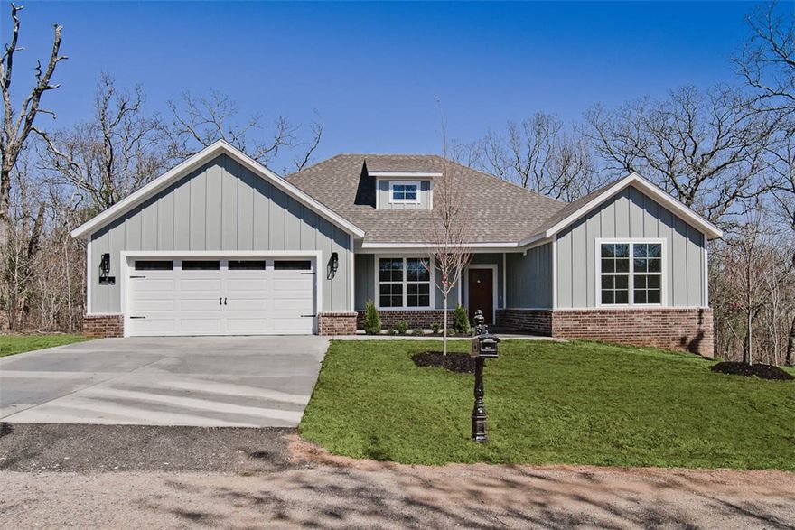 MOVE-IN READY! Stunning new construction home on a flat .36 acre wooded lot! Provides quick access to Scotsdale Golf Course, Lake Loch Lomond, and Branchwood Recreation Center. Step inside to discover a beautifully designed interior with 3BD's + office, a split floor plan, & high-end modern finishes throughout. The spacious living area showcases vaulted ceilings with elegant beams, creating an inviting atmosphere. The kitchen features sleek 3 cm quartz countertops, a gas range, custom cabinets, and premium black stainless-steel appliances. Retreat to the luxurious primary bath, which boasts a huge walk-in closet, a large custom walk-in tile shower, and a soaking tub. 2 covered patios. As an added bonus, receive $3,500 towards buyer's closing costs when working with the builder’s preferred local lender!