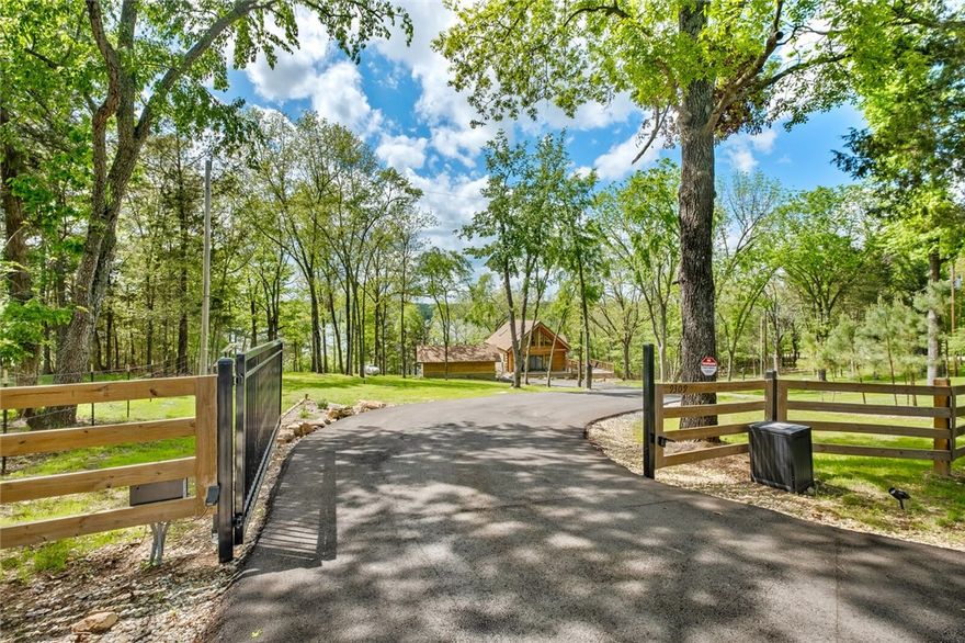 Come enjoy Beaver Lake in this peaceful setting. This "Real Log Homes" cabin was completed in 2023, is constructed of Eastern white pine and sits on 2.32 acres. It's the perfect cabin to escape the busyness of life. Step inside to the main floor and experience the views from the great room's expansive windows, while nestled in front of the warm, cozy fireplace. Here you will also find the kitchen with its beautiful open shelving and granite countertops and a dining room large enough to seat your family and friends. Upstairs is the guest bedroom with its built-in king size bed and relaxing siting area to enjoy your favorite book. The main bedroom suite located downstairs has its own sitting area with fireplace to unwind from the day or enjoy a glass of wine while watching the sun set from your own private patio. This home is complete with full house Generac generator, security system, privacy gate w/ access code, detached garage and outside covered storage area. Purchase price includes furnishings w some exclusions.