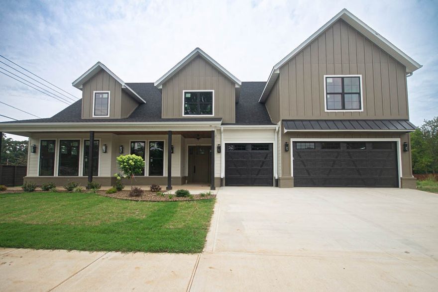 Located in the perfect location w/ easy access to Coler Mountain Bike Preserve trails, schools, downtown Bentonville & more. This stunning home is perfect for entertaining, situated on a large, professionally landscaped lot. Gourmet kitchen features stainless steel Café appliances, custom cabinets, floating shelves, two dishwashers, spacious island with upgraded granite countertops, working pantry & large dining area. Two-story living room, with its corner gas fireplace and wood floors, offers a warm & inviting atmosphere. Primary bedroom boasts wood flooring, custom stained tray ceiling & accent wall, leading to a spa-like ensuite with double sinks, soaking tub, walk-in tile shower & large walk-in closet with laundry room access. Study with French doors & custom stained beams, secondary downstairs suite ideal for a mother-in-law suite & large upstairs bonus room with built-in wet bar. Additional features include bike storage in the garage, bike washing station & spacious covered patio overlooking the backyard.