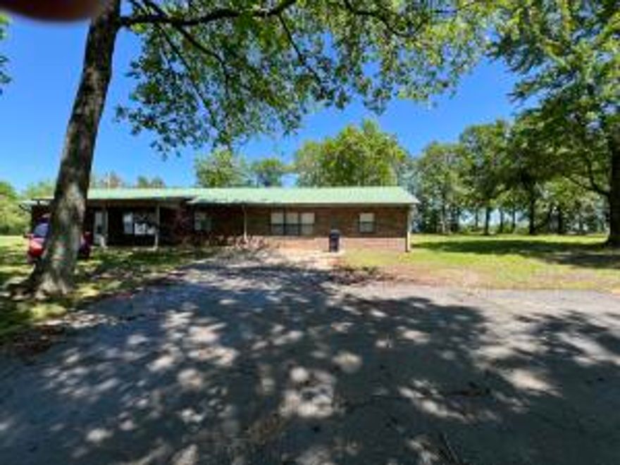 Enjoy the matinance free exterior of this brick home, including the metal roof, gutters and downspouts.  Nice split floor plan with oversized primary bedroom with walk-in closet.  Nice detatched shop / garage all sitting on a nice shaded one acre lot.  Seller is giving a $4000.00 flooring allowance for the 2 bedrooms in need of flooring.