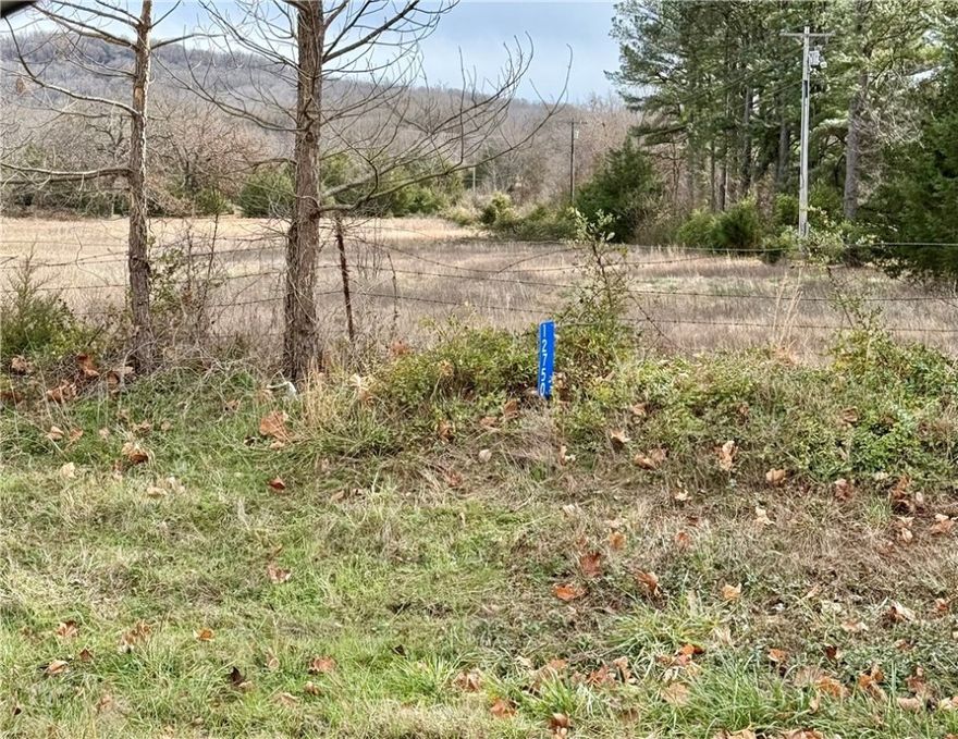 Great building site on 2.76 AC with highway frontage! Perk test has been done. Water tap is needed. Open and ready for your new home