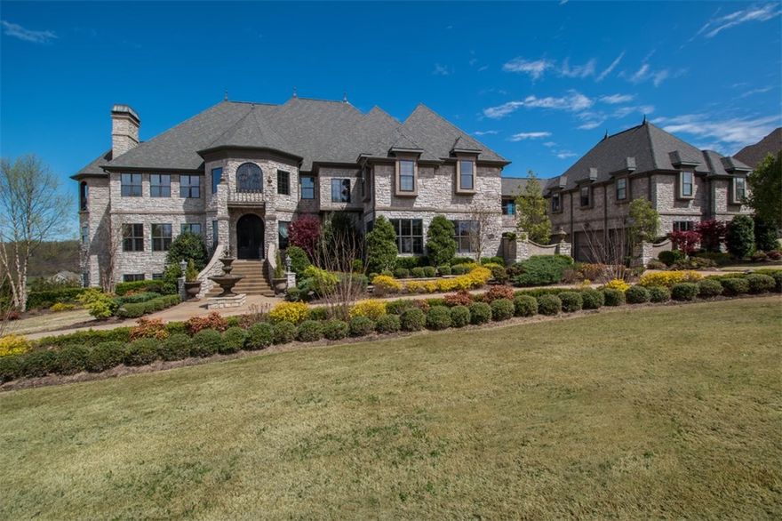 Magnificent 12,230 sq ft European estate on 2.19 acres located near Arvest Ballpark, Tyson HQ, XNA, U of A & more! This estate consists of 7 bedrooms, controlled wine cellar, theater room, game room w/bar, 4 staircases, multiple living areas, office, 2 story library, formal dining room w/tea room & waterfall, apt w/separate entrance, sauna & more. Outside enjoy this resort style retreat during all seasons. Multiple outdoor living spaces,  heated infinity pool w/swim up bar, 3 waterfalls, & fireplace. MUST SEE!